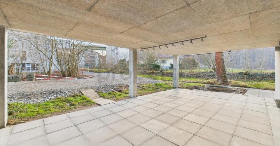 Wohnen in einer Ikone der Schweizer Architektur | Einzigartige Maisonettewohnung im denkmalgeschützten Atelier-5-Ensemble in Flamatt