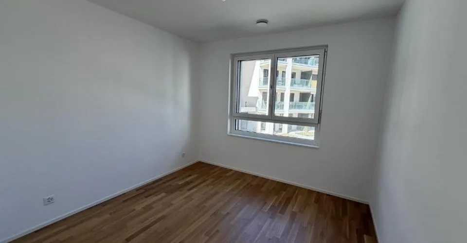 Magnifique appartement de 2.5 pièces au 1er étage d'un immeuble neuf avec balcon - E102
