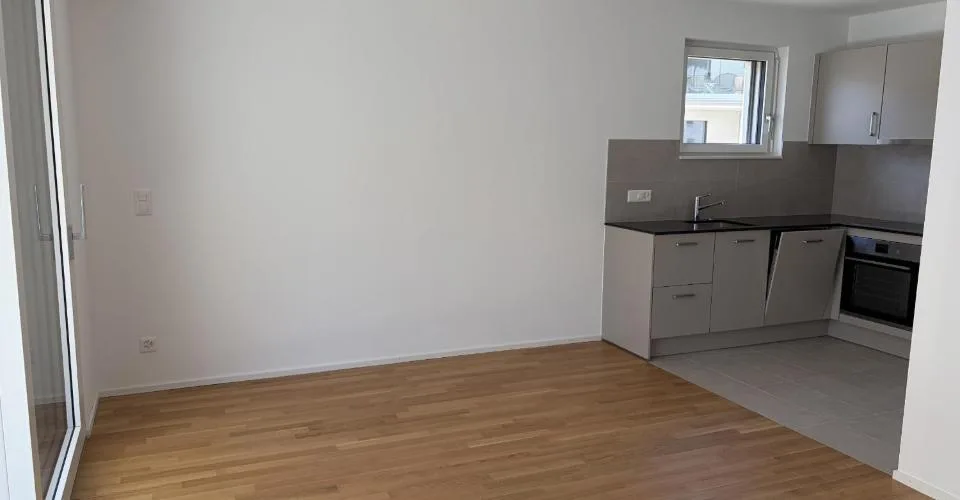 Magnifique appartement de 2.5 pièces au 1er étage d'un immeuble neuf avec balcon - E102