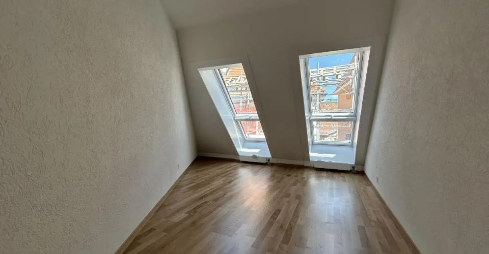 Au cour de la ville - Appartement mansardé de 4.5 pièces