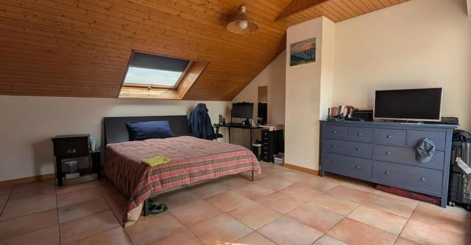 Duplex en attique au coeur de Bussigny dans un cadre verdoyant