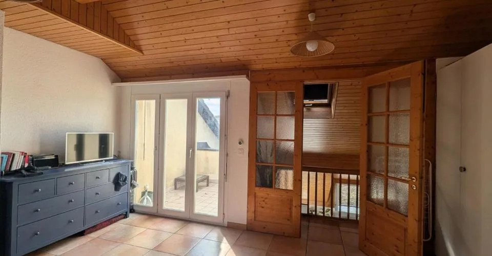 Duplex en attique au coeur de Bussigny dans un cadre verdoyant