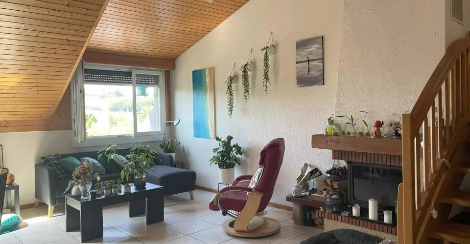 Duplex en attique au coeur de Bussigny dans un cadre verdoyant