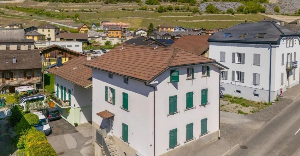 Petit immeuble au coeur du villlage avec rendement brut à 4.5%