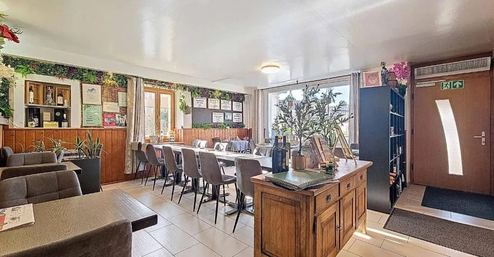Immeuble d'habitation avec café-restaurant au coeur de la Broye