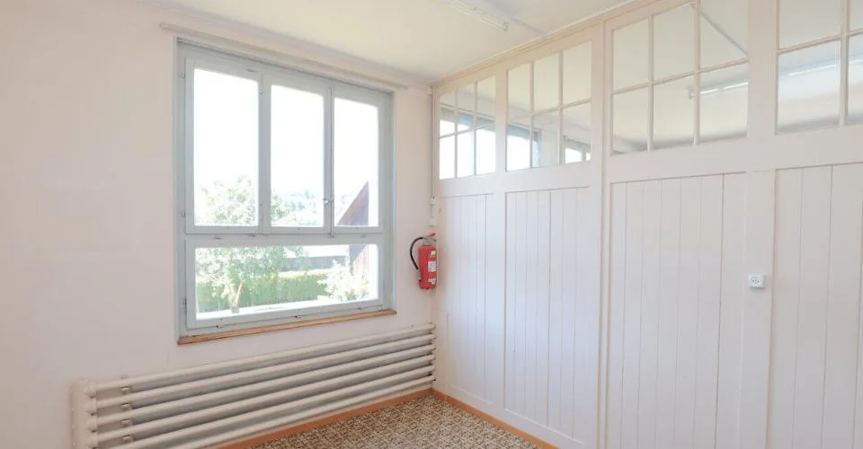 Immeuble mixte de 3 appartements et locaux artisanaux à Porrentruy