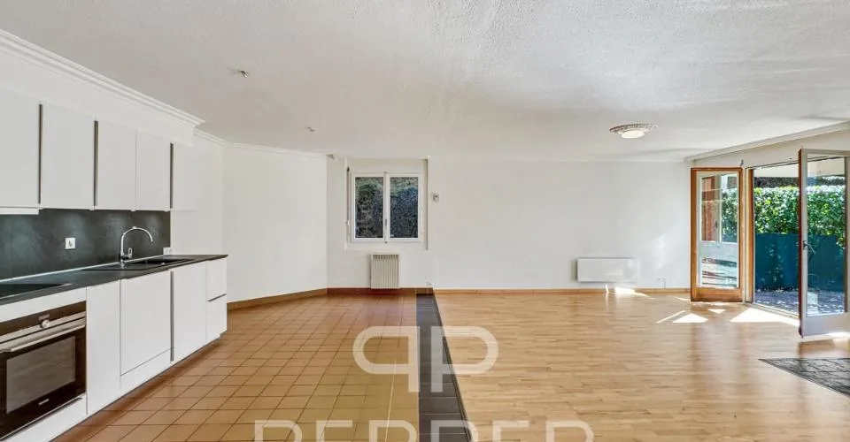 Vaste appartement en rez-de-jardin au coeur de Chailly