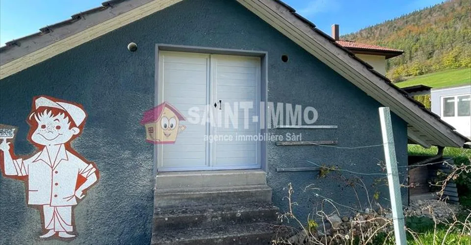VENDU - Maison de 7 pièces avec jardin, ateliers (+100m2), 3 garages à Sonceboz