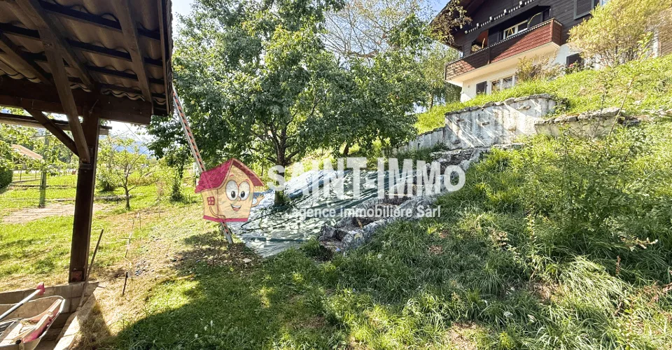 Chalet composé de deux appartements (3 & 6.5 pièces) avec jardin arboré de 840 m2, terrasse et garages – Foto 4 von 25