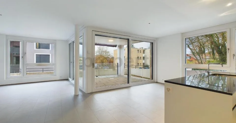 Modern kitchen island, seating area with garden & Minergie standard! – photo 10 of 18