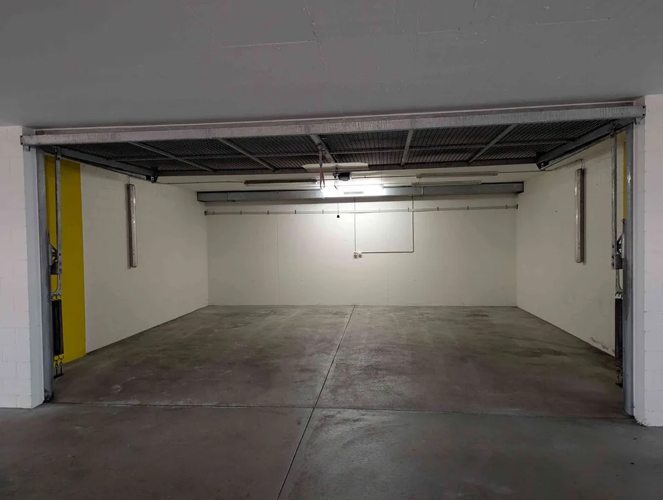 Garage parking space with gate separation