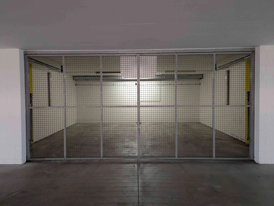 Garage parking space with gate separation