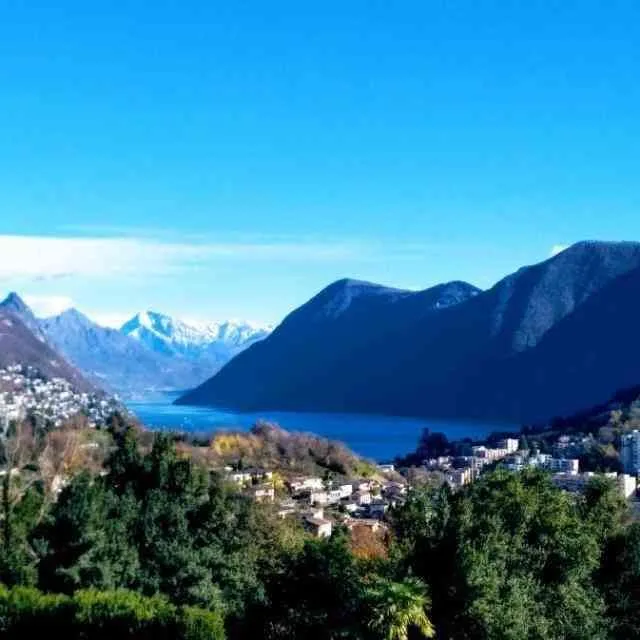 Rent luxury 6-room duplex penthouse with lake view in MontagnolaTASIS