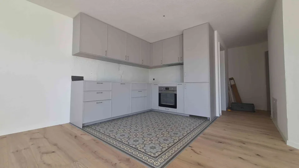 2-Zimmer-Einliegerwohnung EG mit eigenem Sitzplatz, inkl. P+aller NK