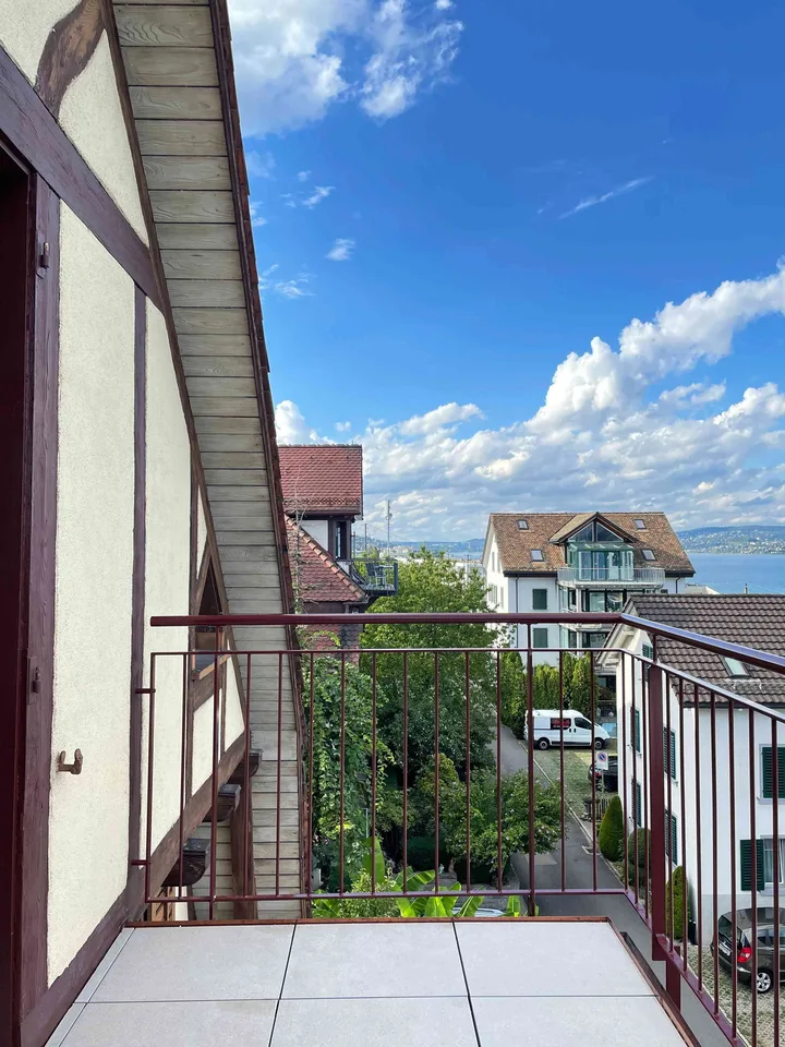 Exceptional Attic Apartment in Thalwil with 180° Views of Lake Zurich