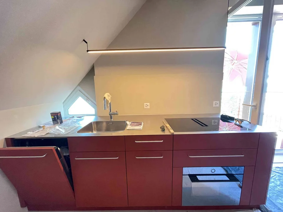 Exceptional Attic Apartment in Thalwil with 180° Views of Lake Zurich