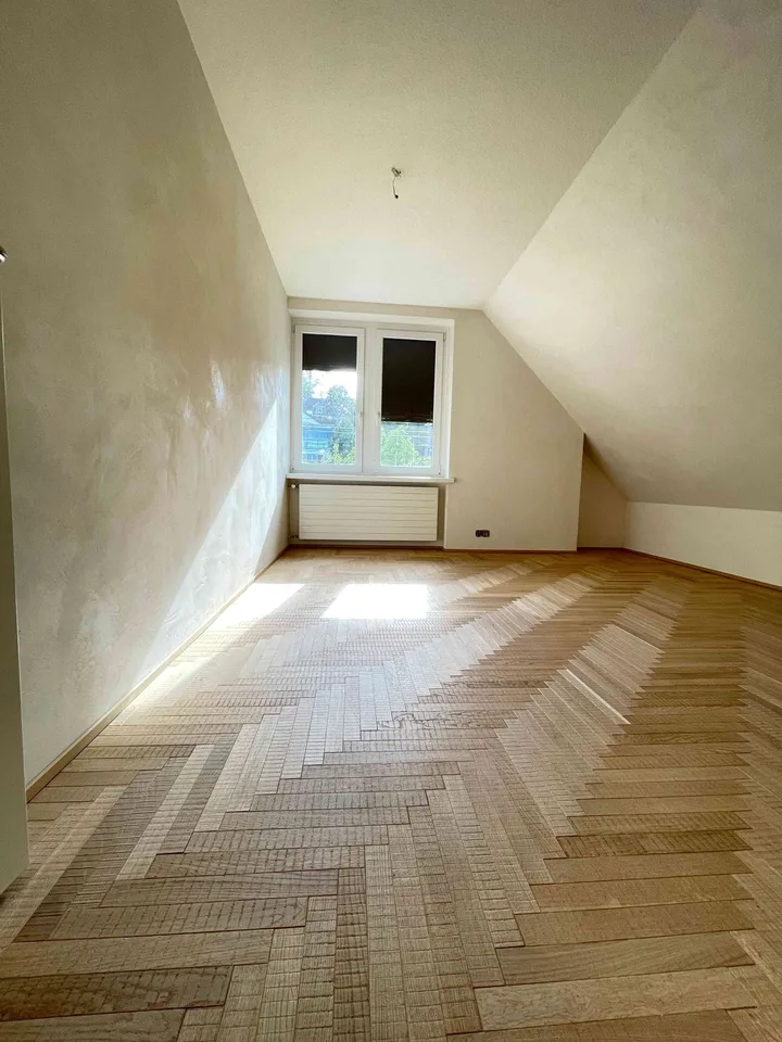 Exceptional Attic Apartment in Thalwil with 180° Views of Lake Zurich