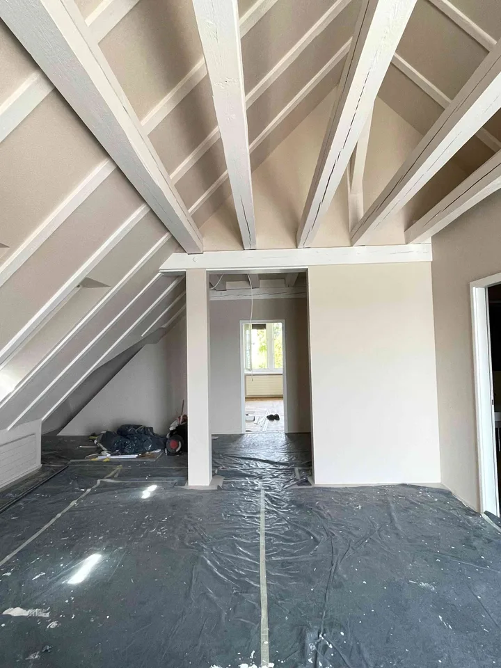 Exceptional Attic Apartment in Thalwil with 180° Views of Lake Zurich