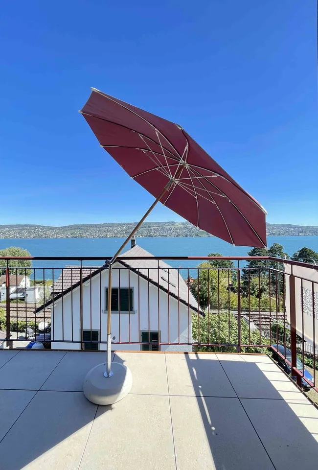 Exceptional Attic Apartment in Thalwil with 180° Views of Lake Zurich