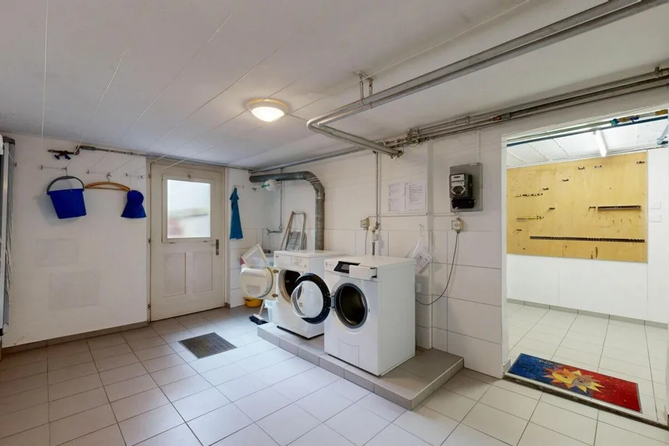 Maison multifamiliale entièrement louée avec 3 appartements et 2 garages – photo 26 sur 29