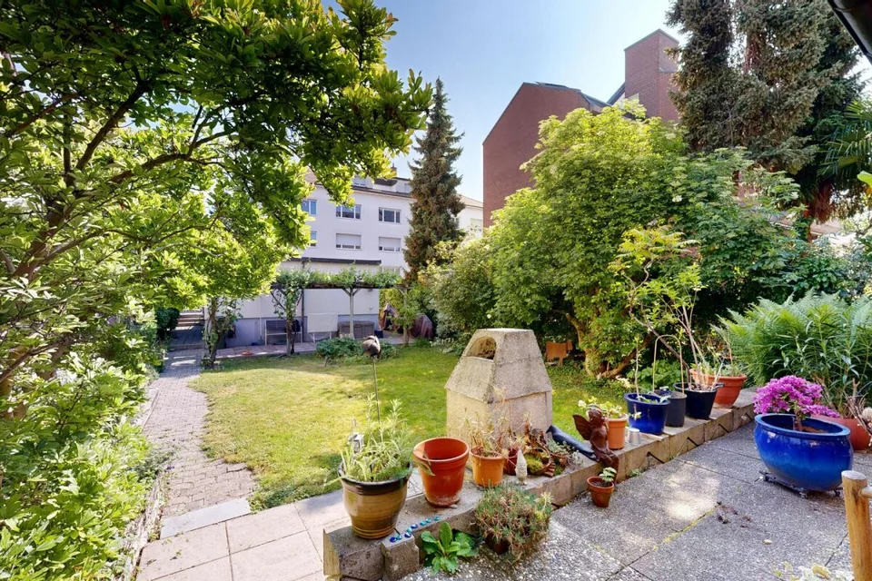 Maison multifamiliale entièrement louée avec 3 appartements et 2 garages – photo 7 sur 29