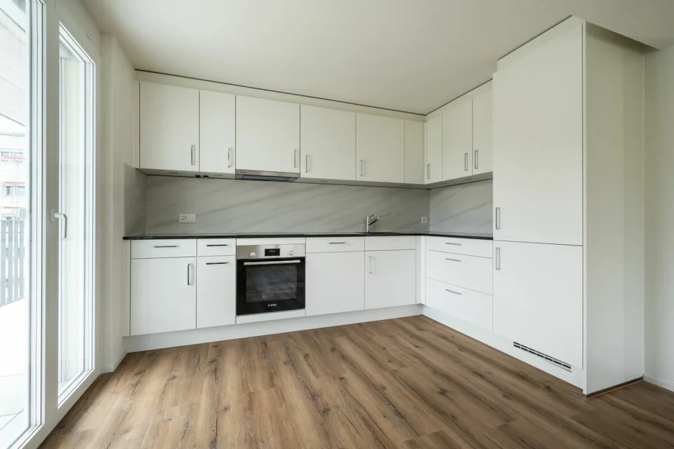 Exklusive 3.5-Zimmer-Gartenwohnung mit gedecktem Sitzplatz und privater Grünfläche