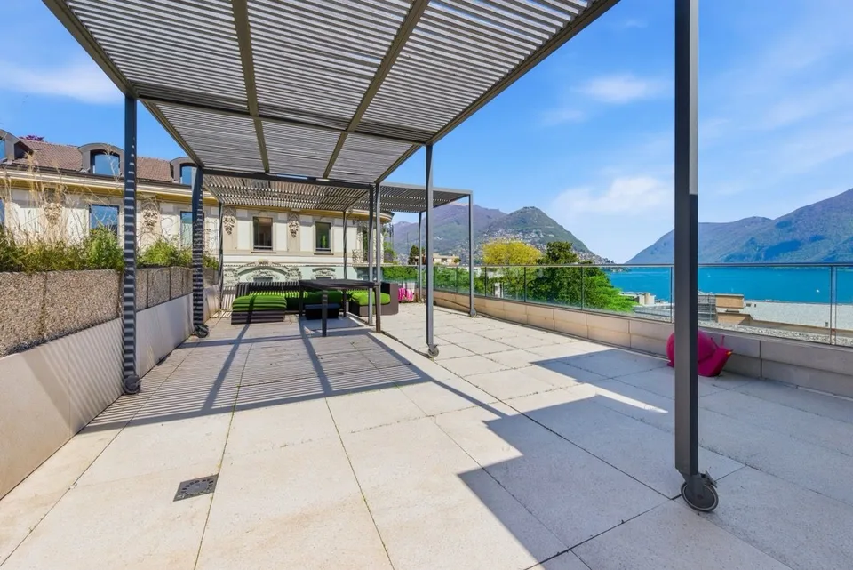 Exclusive penthouse with panoramic rooftop and breathtaking views over Lake Lugano