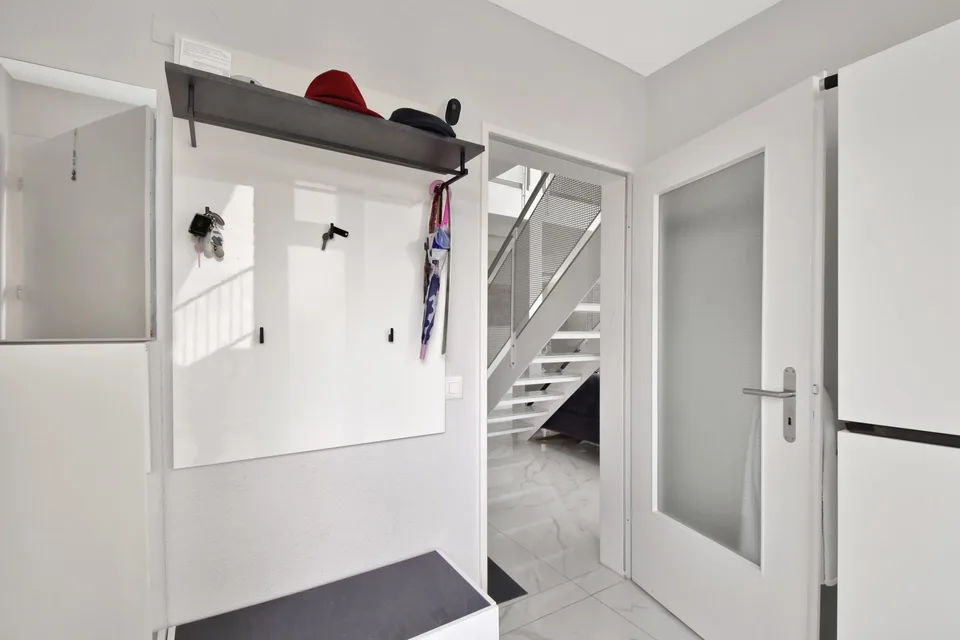 Appartement-maisonnette attractif de 5,5 pièces avec jardin, salle de loisirs et 3 places de parking souterraines – photo 9 sur 28