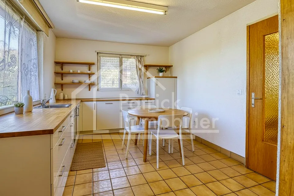 Maison mitoyenne avec vue imprenable sur le lac de Morat et fort potentiel constructible