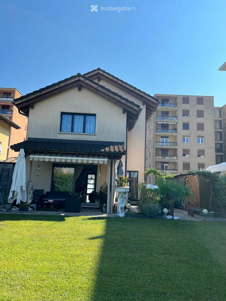 Maison unifamiliale avec jardin et 2 places de parking