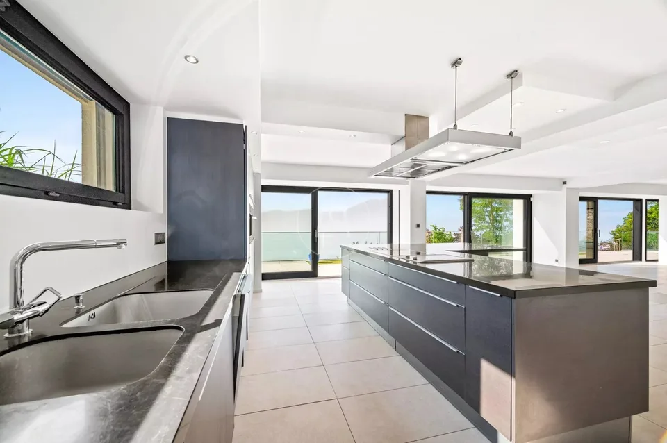 Breathtaking view of the Chardonne heights with pool