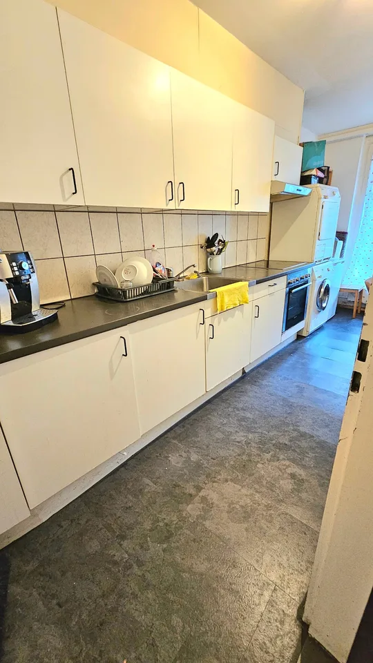Emplacement central privilégié : Maison multifamiliale avec 7 appartements et restaurant – photo 7 sur 10