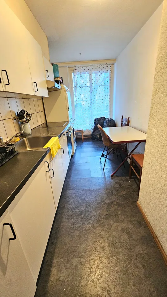 Emplacement central privilégié : Maison multifamiliale avec 7 appartements et restaurant – photo 8 sur 10