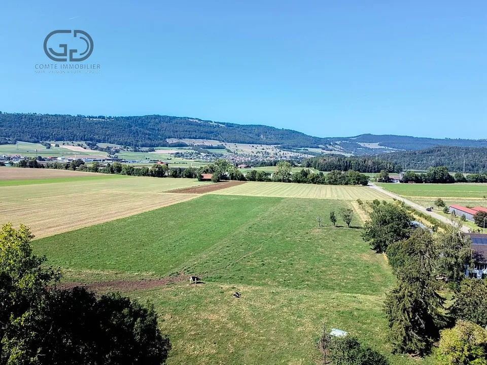 Terrain à bâtir en bordure de zone agricole