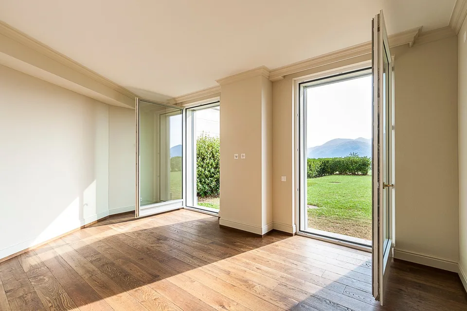 COLLINA D'ORO - AFFITTASI INCANTEVOLE APPARTAMENTO CON GIARDINO PRIVATO E VISTA LAGO (rif. 002)