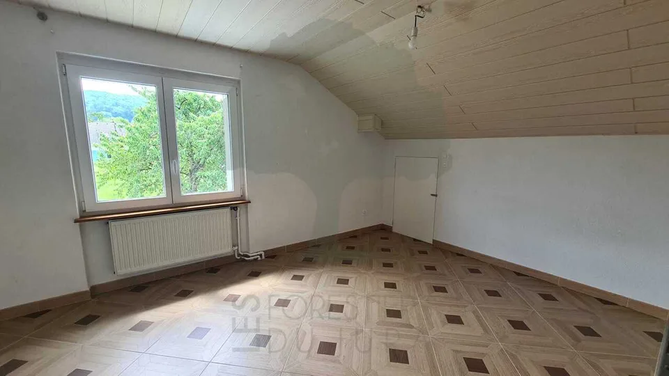 Casa familiare a due appartamenti di 3,5 locali e tre garage – foto 6 di 13