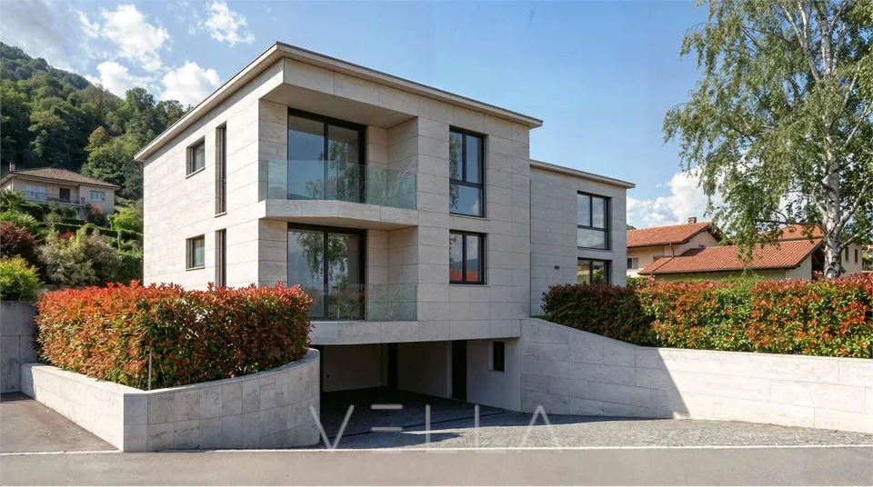 Nuova proprietà in Collina d'Oro: casa bifamiliare con due appartament