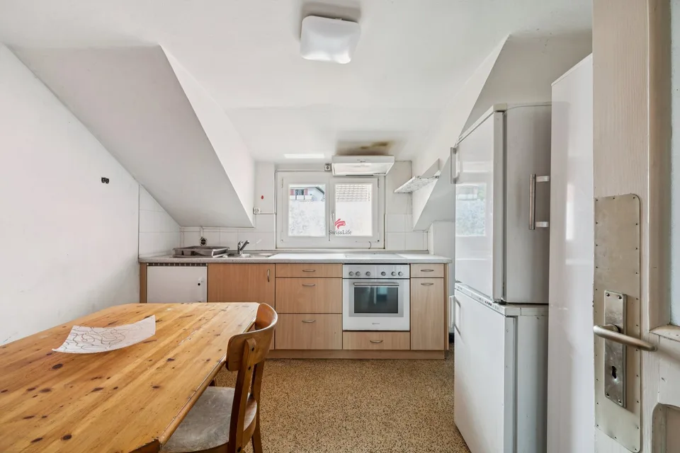 Maison villageoise de 6 appartements et 10 places de parc avec grange