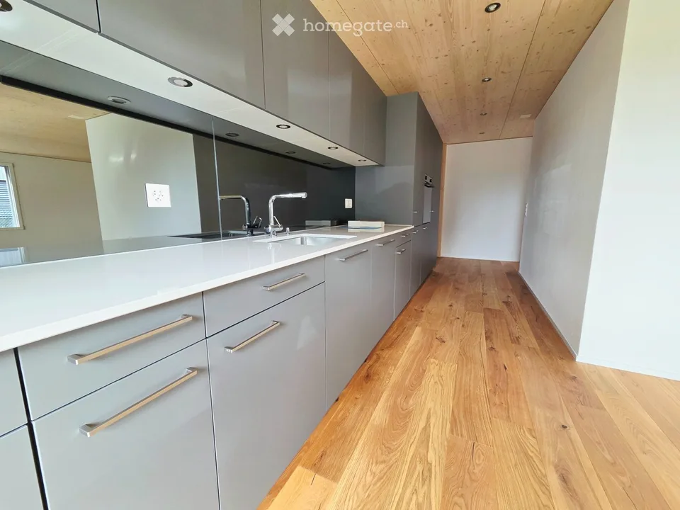 Moderne Neubauwohnung mit Garten im Dorfzentrum