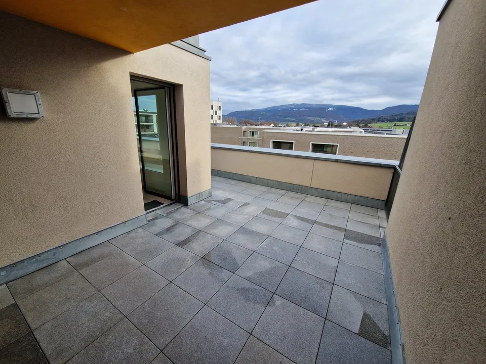 Magnificent bright attic with terrace – Unobstructed view in the center of Delémont