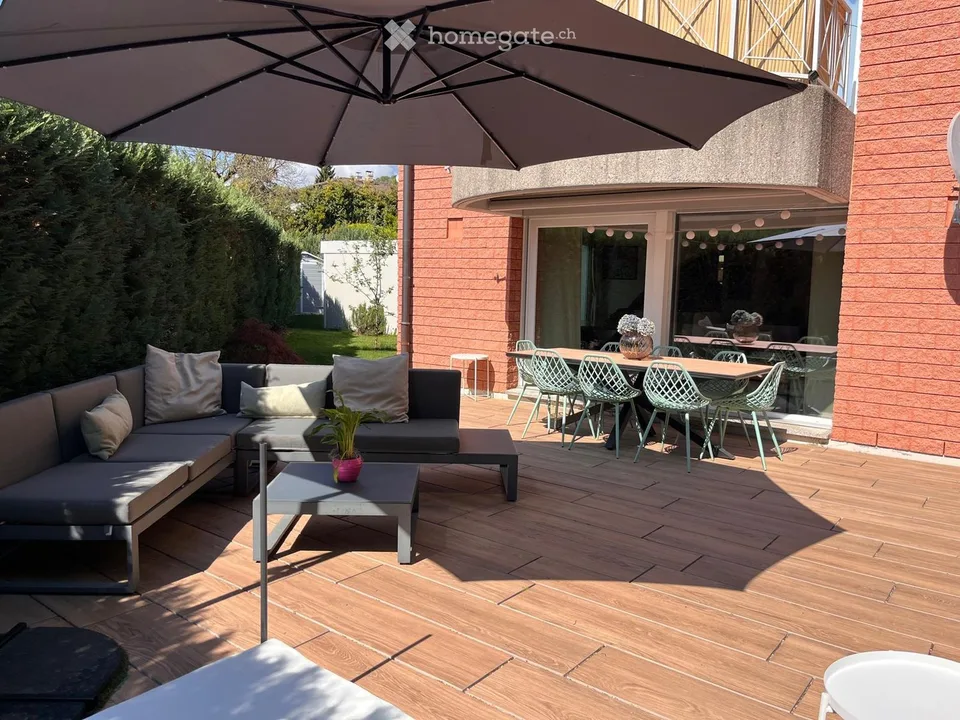 Maison unifamiliale à Porza avec jardin, 3 chambres et garage double avec recharge électrique