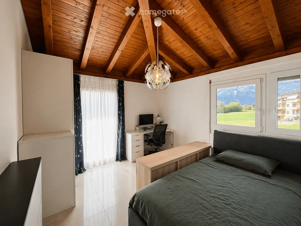 Maison unifamiliale à Porza avec jardin, 3 chambres et garage double avec recharge électrique