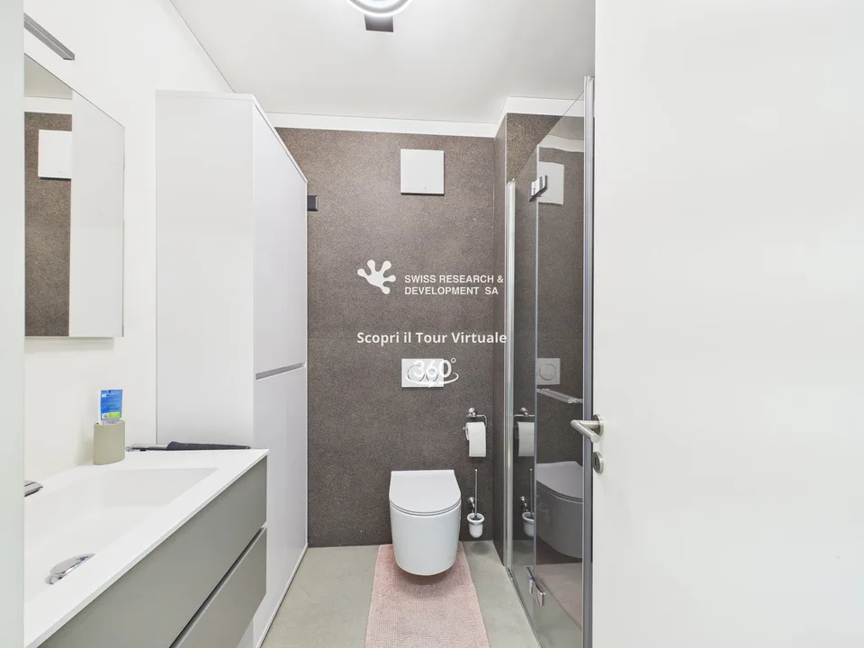 CONTEMPORANEO APPARTAMENTO DI 3,5 LOCALI CON AMPIA TERRAZZA E DOMOTICA INTEGRATA – Foto 18 von 26