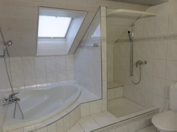 Appartement mansardé accueillant dans un emplacement central avec vue sur la verdure
