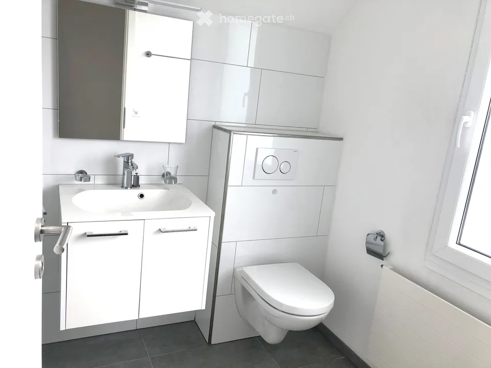 Appartamento mansardato moderno 2.5 locali con balcone in posizione centrale