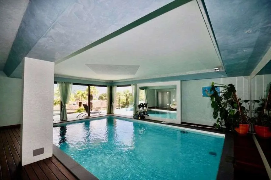 Exklusive Villa mit Seeblick in Comano – Foto 9 von 10