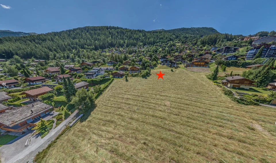 Grand terrain viabilisé dans un quartier résidentiel très proche du centre de la station