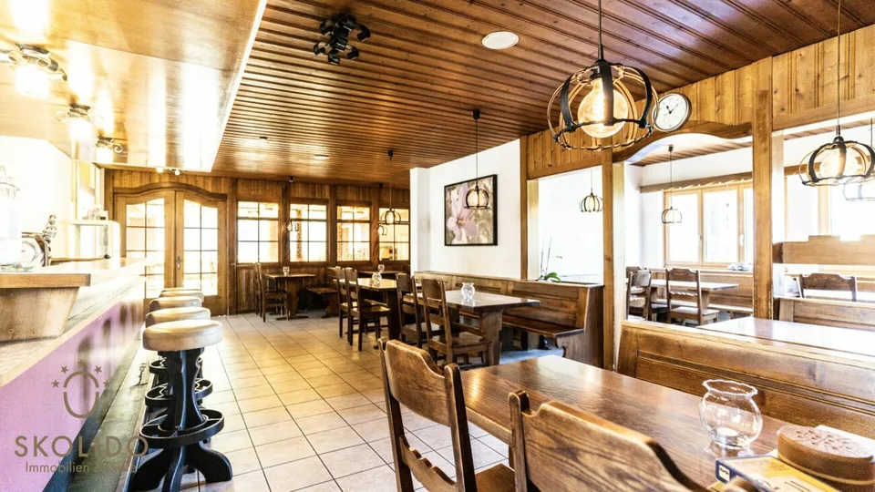 Village shop, large restaurant with terrace, duplex apartment, garages, and building land in the heart of Mund