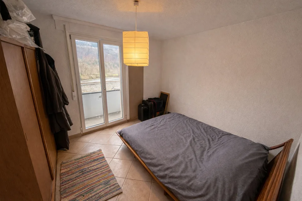 APPARTEMENT DE 3.5 PCES AU 1ER ETAGE AVEC GARAGE BOX ET PLACE EXT.