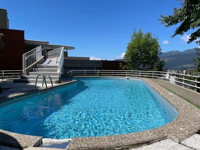 Spazioso appartamento di 2.5 locali con piscina  e vista panoramica a Ruvigliana